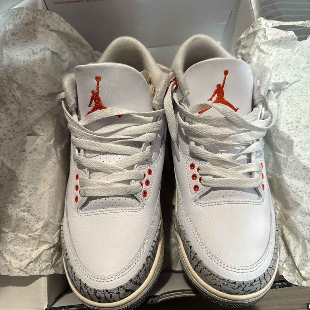 Jordan White and Orange Athletic Shoes with Signature Design